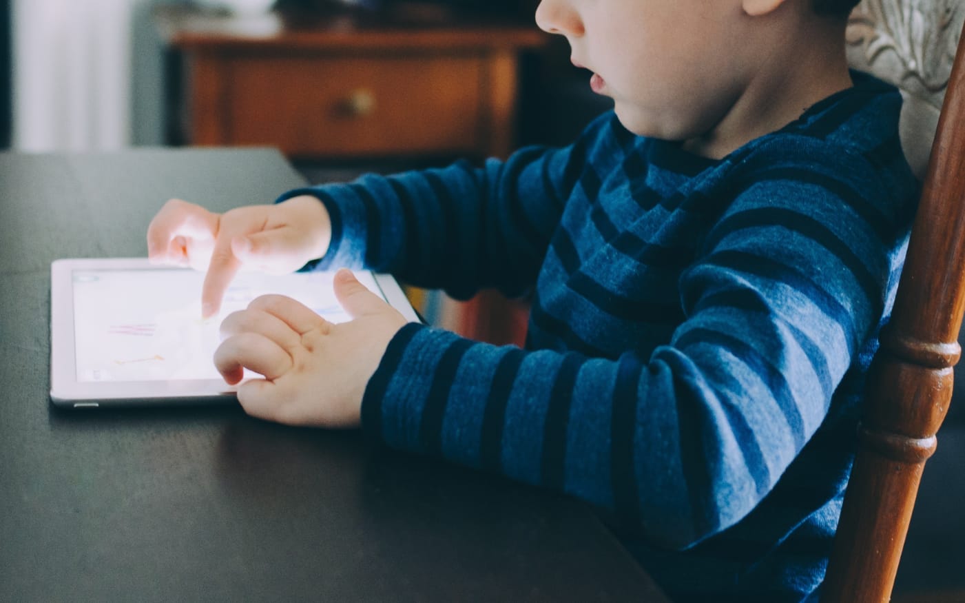 kid with iPad